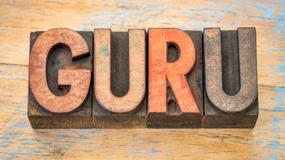 picture of wooden letters forming the word guru